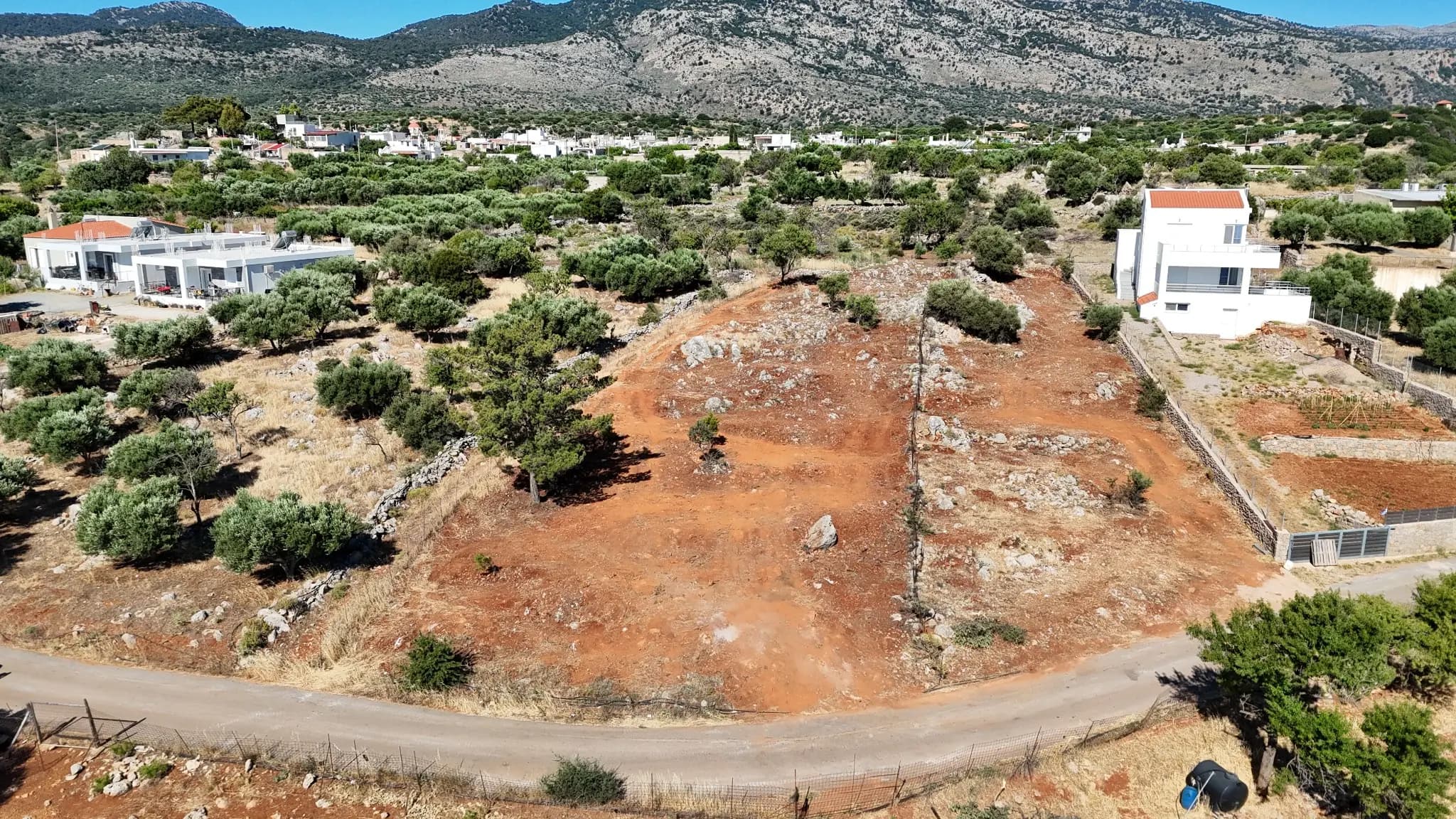 Aerial view of the Mourí site, road frontage and surrounding Kroustas landscape