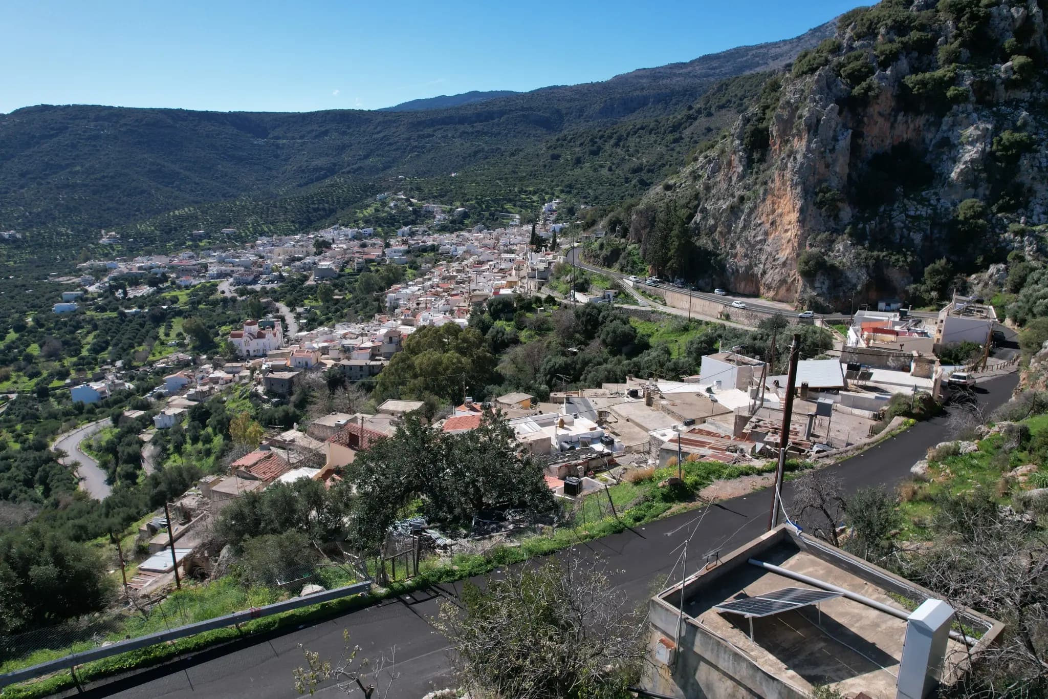 View across Kritsa village and its limestone escarpment from Próvarma